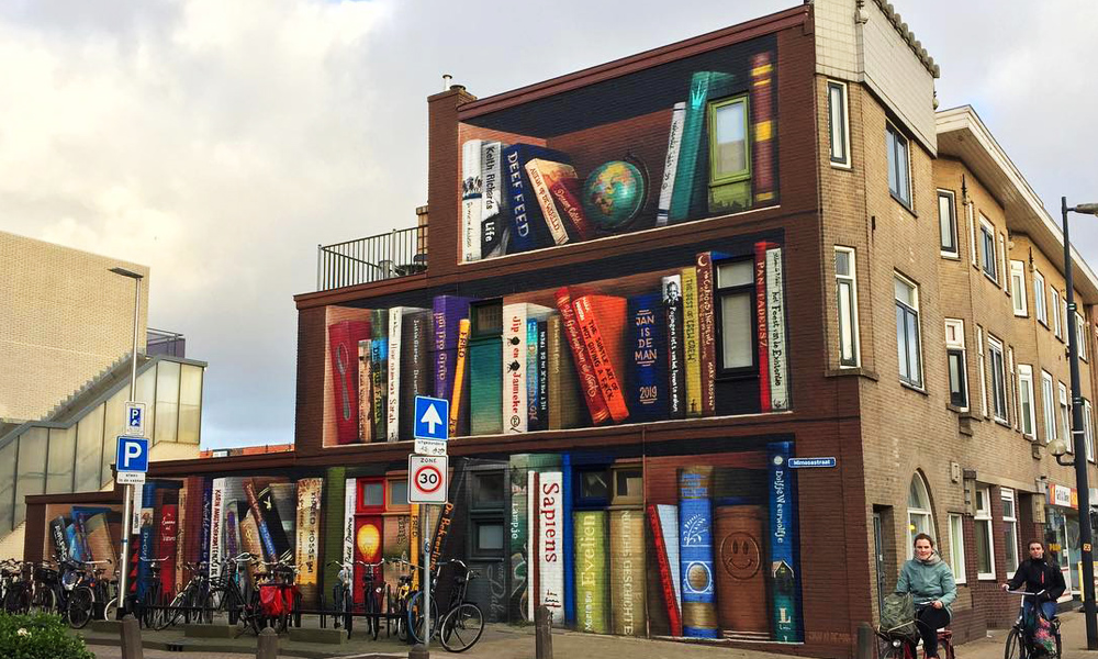 This Building Has a Tri-Level Bookcase Mural on the Side